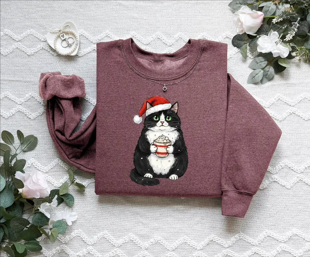 Cute Christmas Black Cat crewneck sweatshirt pictured in Heather Maroon.