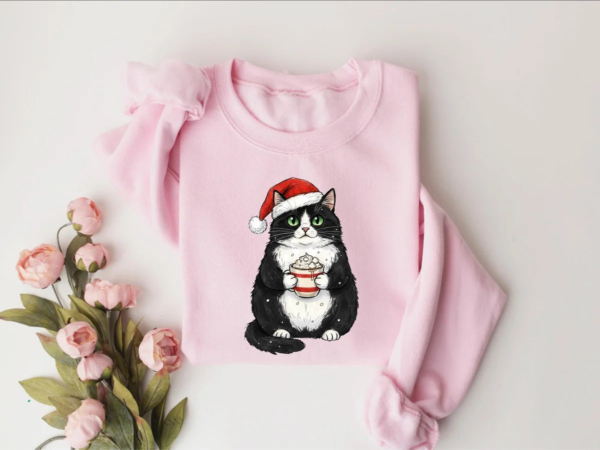 Cute Christmas Black Cat crewneck sweatshirt pictured in Light Pink.