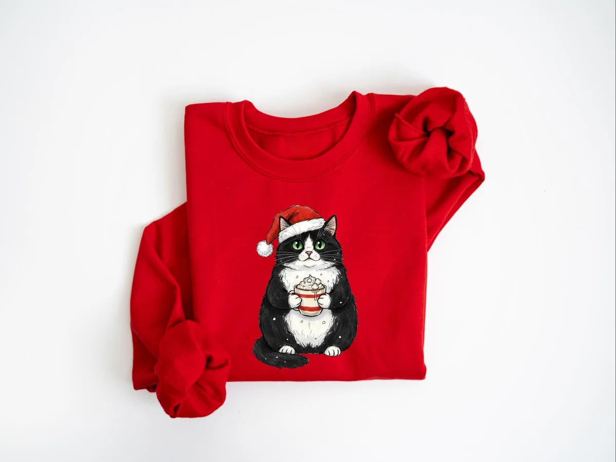 Cute Christmas Black Cat Crewneck Sweatshirt shown on a model in Red.