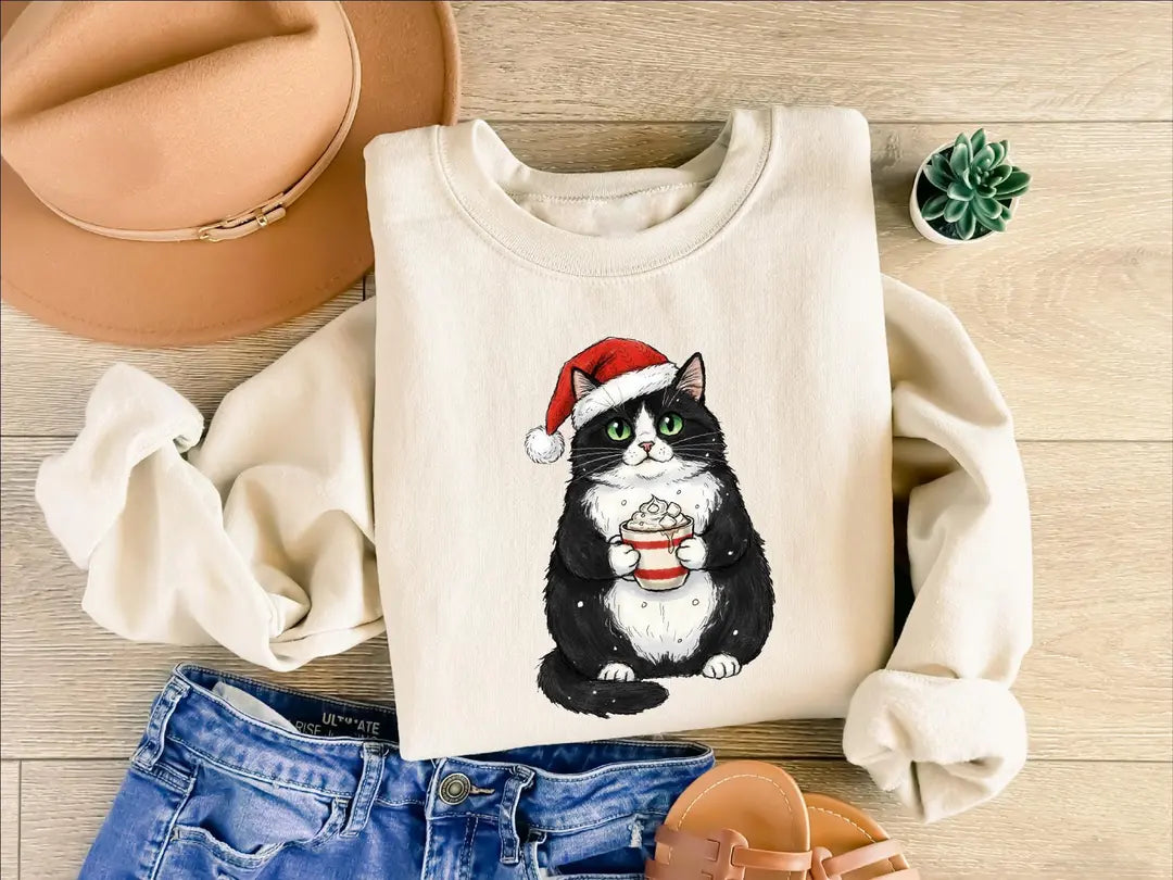 Cute Christmas Black Cat crewneck sweatshirt pictured in Sand.