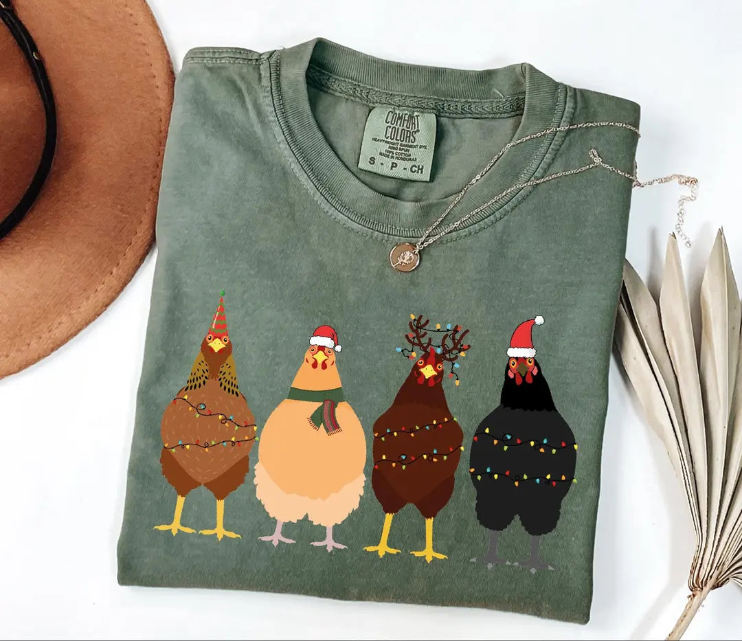 Four Christmas Chickens with String Lights graphic Comfort Colors T-shirt, additional product photograph.