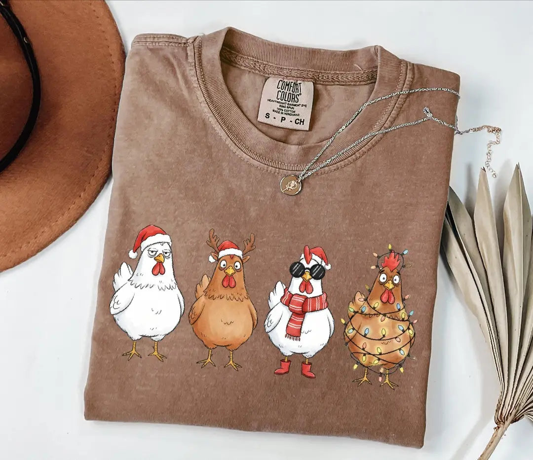 Comfort Colors T-shirt with Funny Christmas Chickens in Holiday Costumes - holiday design; model photo.