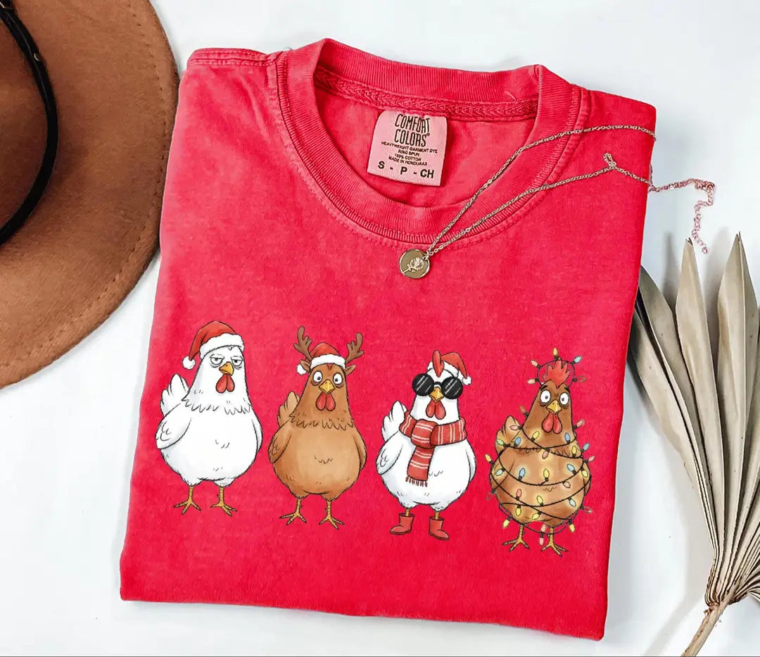 Comfort Colors T-shirt with Funny Christmas Chickens in Holiday Costumes - holiday design; model photo.