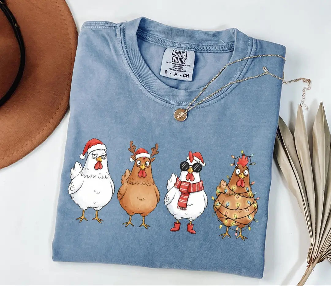 Comfort Colors T-shirt with Funny Christmas Chickens in Holiday Costumes - holiday design; model photo.