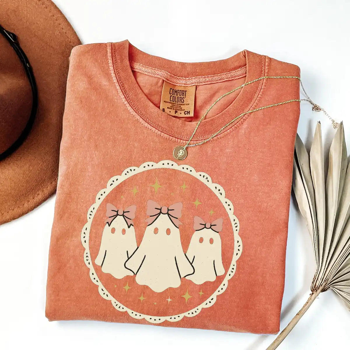 Comfort Colors T-shirt in Ivory color featuring ghosts with bows graphic