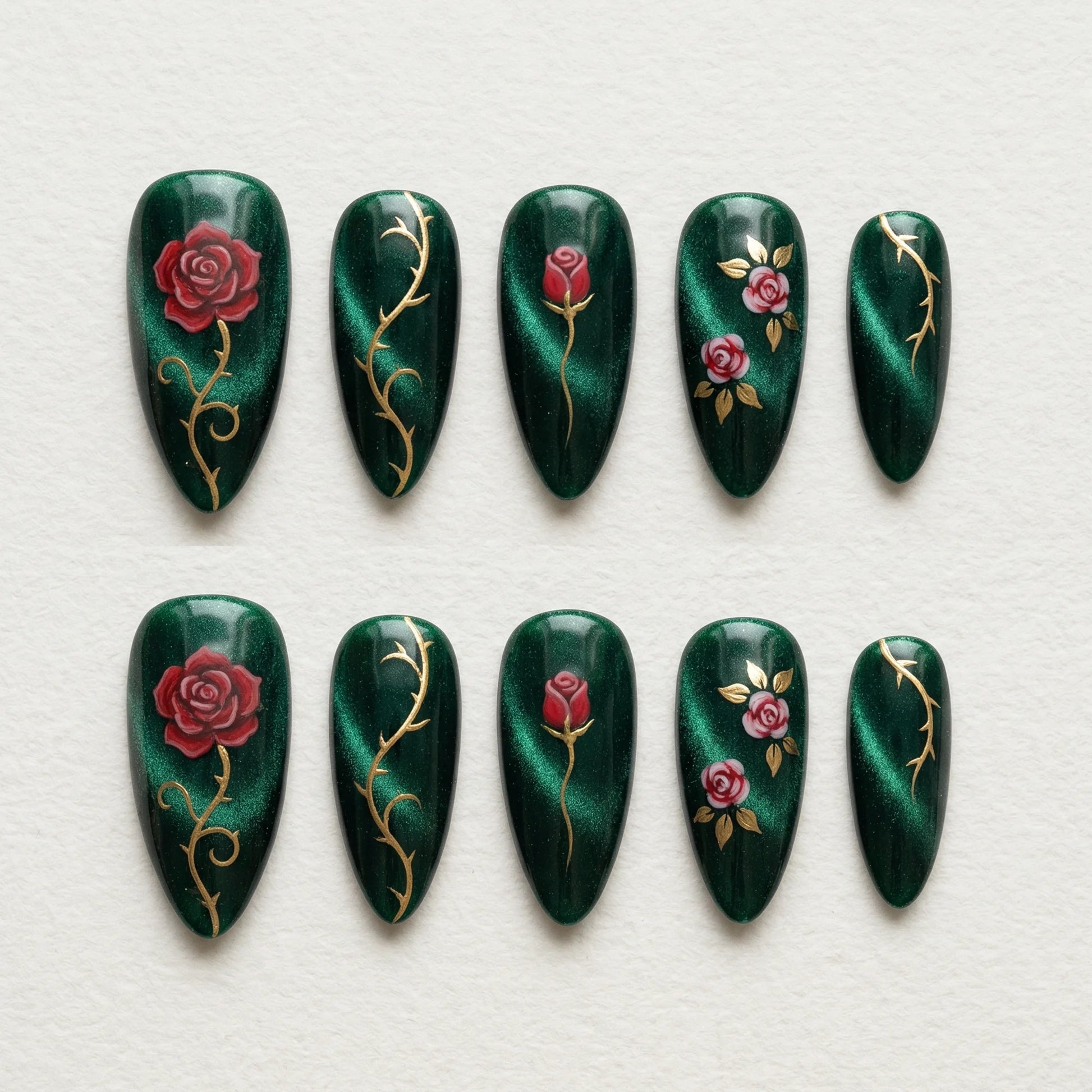 dark green cat eye hand painted stiletto medium press on nails red rose gold vine flat lay 01