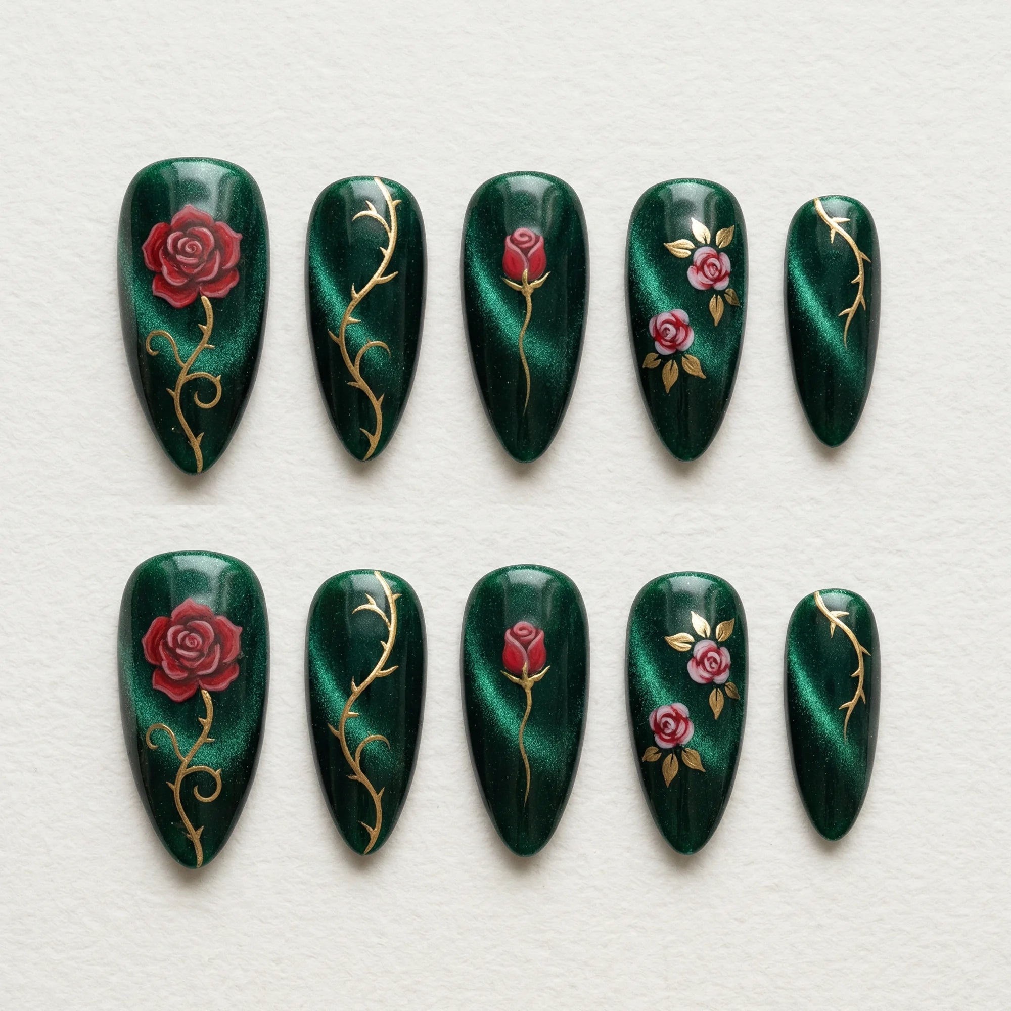 dark green cat eye hand painted stiletto medium press on nails red rose gold vine flat lay 01