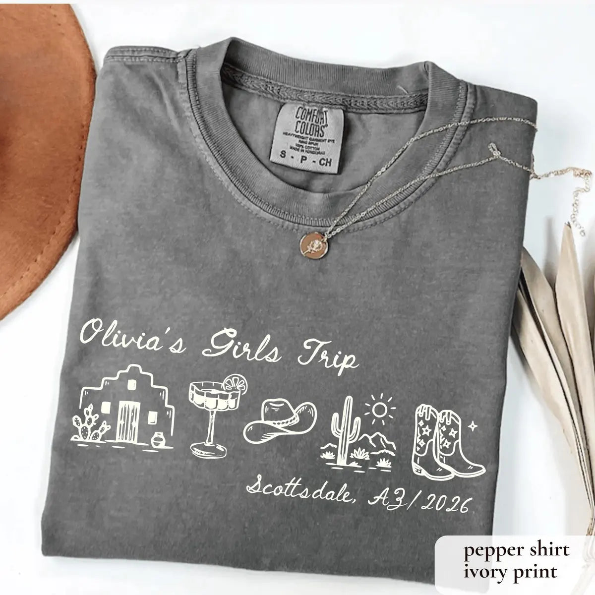 Folded Pepper Comfort Colors tee with ivory Olivia's Girls Trip script, adobe house, margarita, cowboy hat and boots