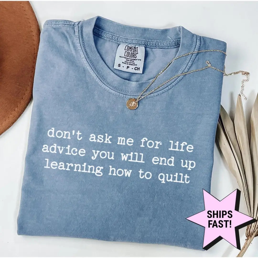 Folded Blue Jean Comfort Colors tee with the quilting quote don't ask me for life advice in white typewriter letters