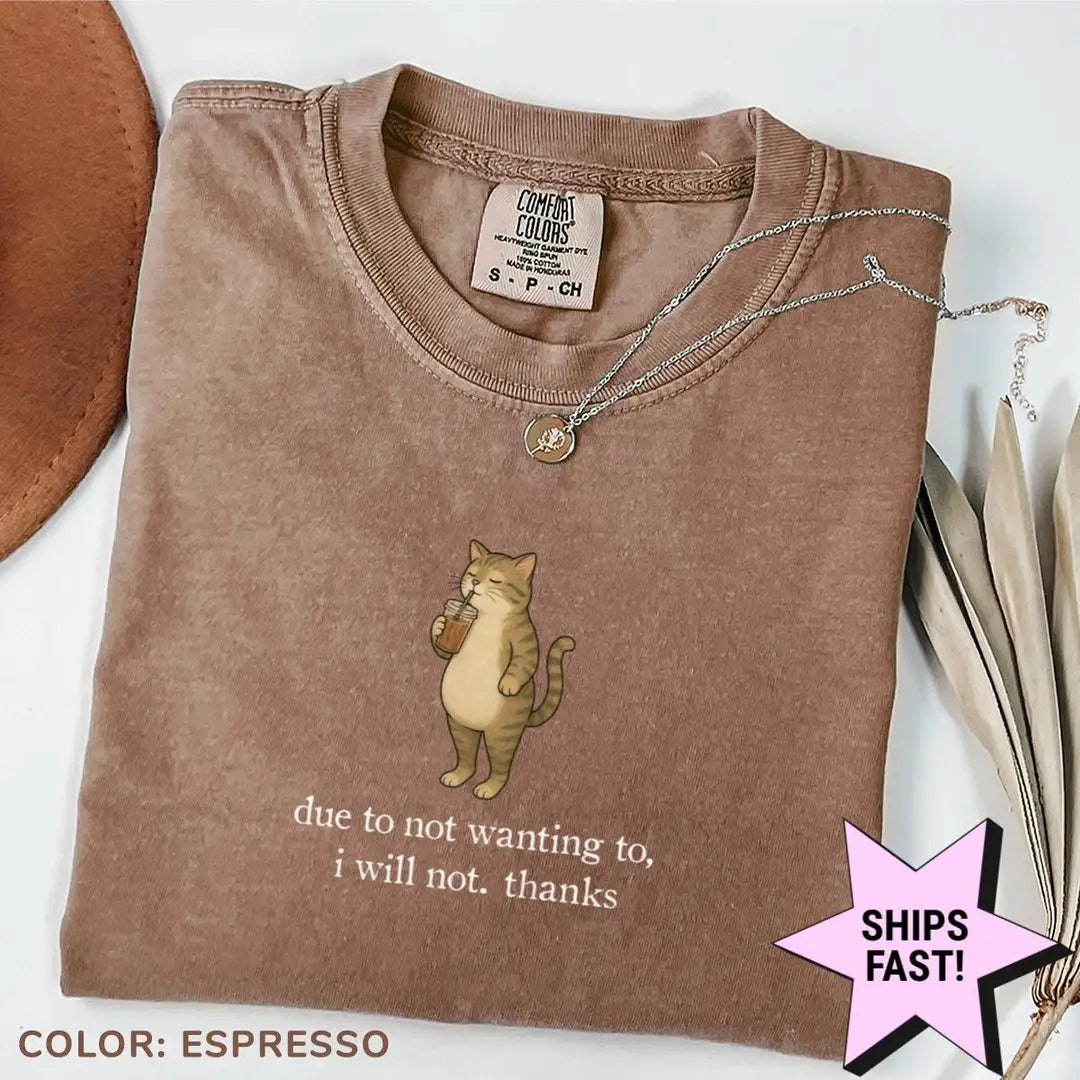 Folded Espresso brown Comfort Colors tee with a tabby cat and drink above due to not wanting to, i will not. thanks