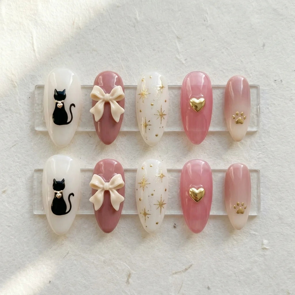 dusty rose blush pink 3d ombre almond press on nails cat ribbon bow gold paw glitter flat lay 04