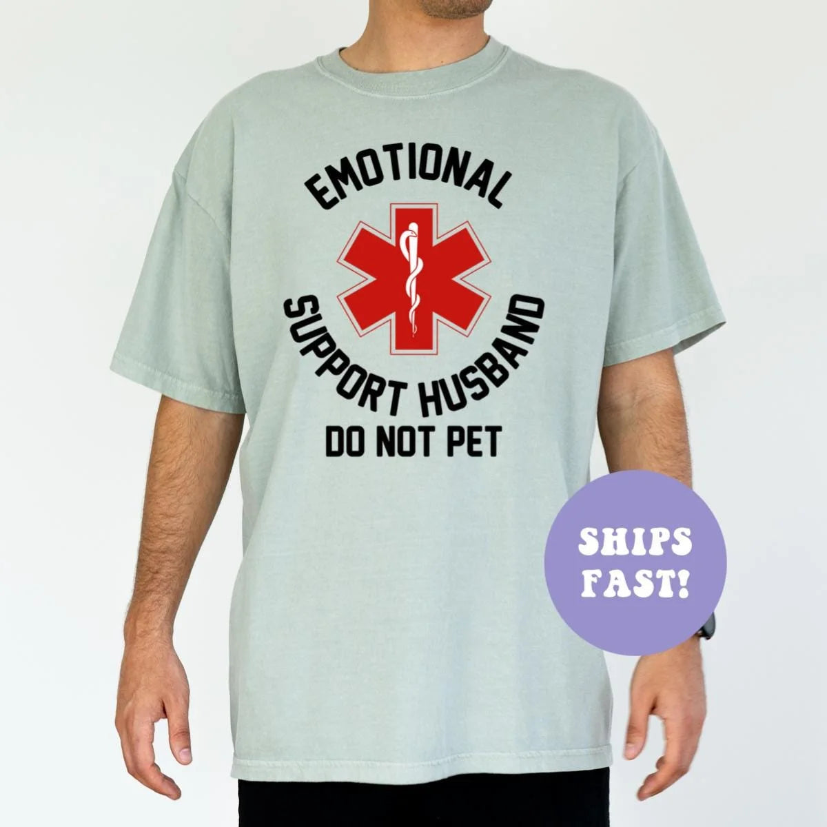 Man in a Seafoam Comfort Colors tee with a red medical star inside black circular emotional support husband text