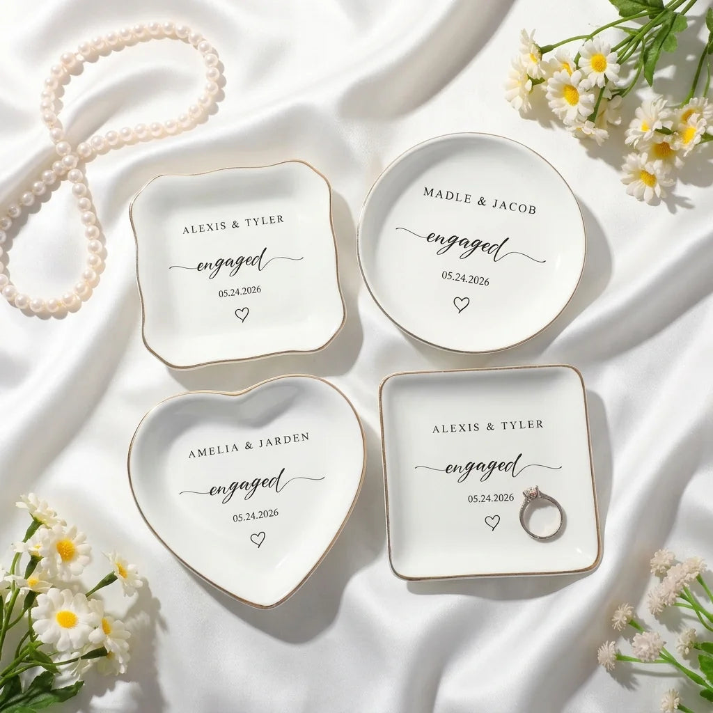 Close-up of calligraphy engaged script and couple names on ring dish