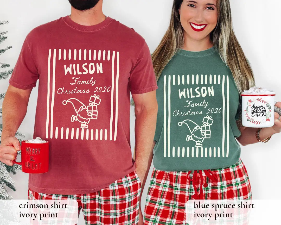 Man in a Crimson and woman in a Blue Spruce Comfort Colors tee with holiday mugs and plaid pants, white Wilson Family frame
