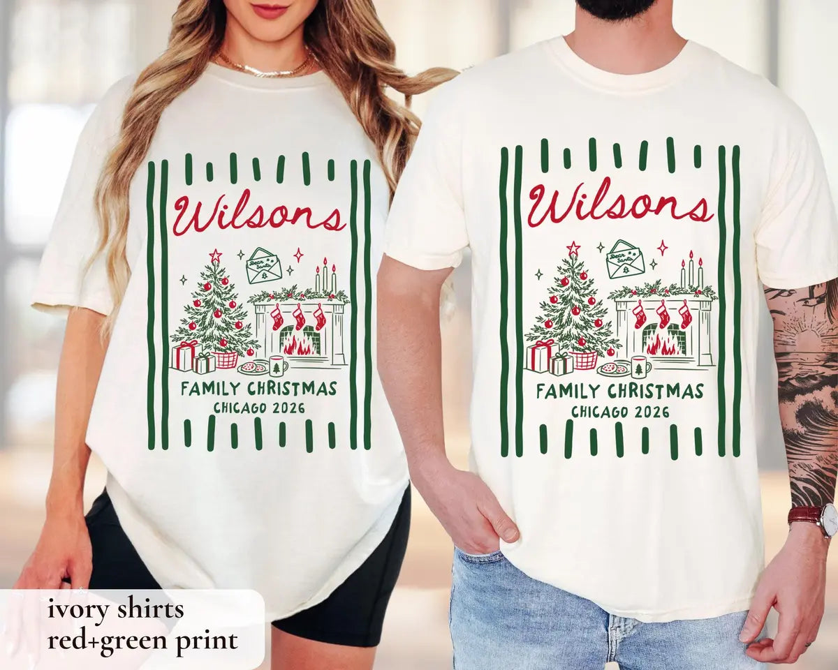 Woman and man in Ivory Comfort Colors tees, red and green Wilsons script over a tree and fireplace between stripes