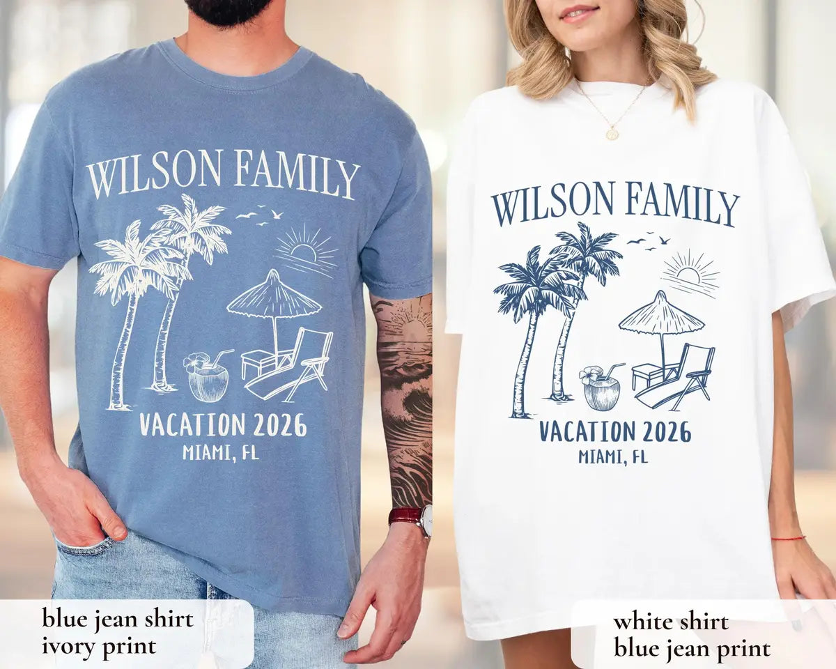 Man and woman in Blue Jean and White Comfort Colors tees, Wilson Family above palms, umbrella and coconut drink