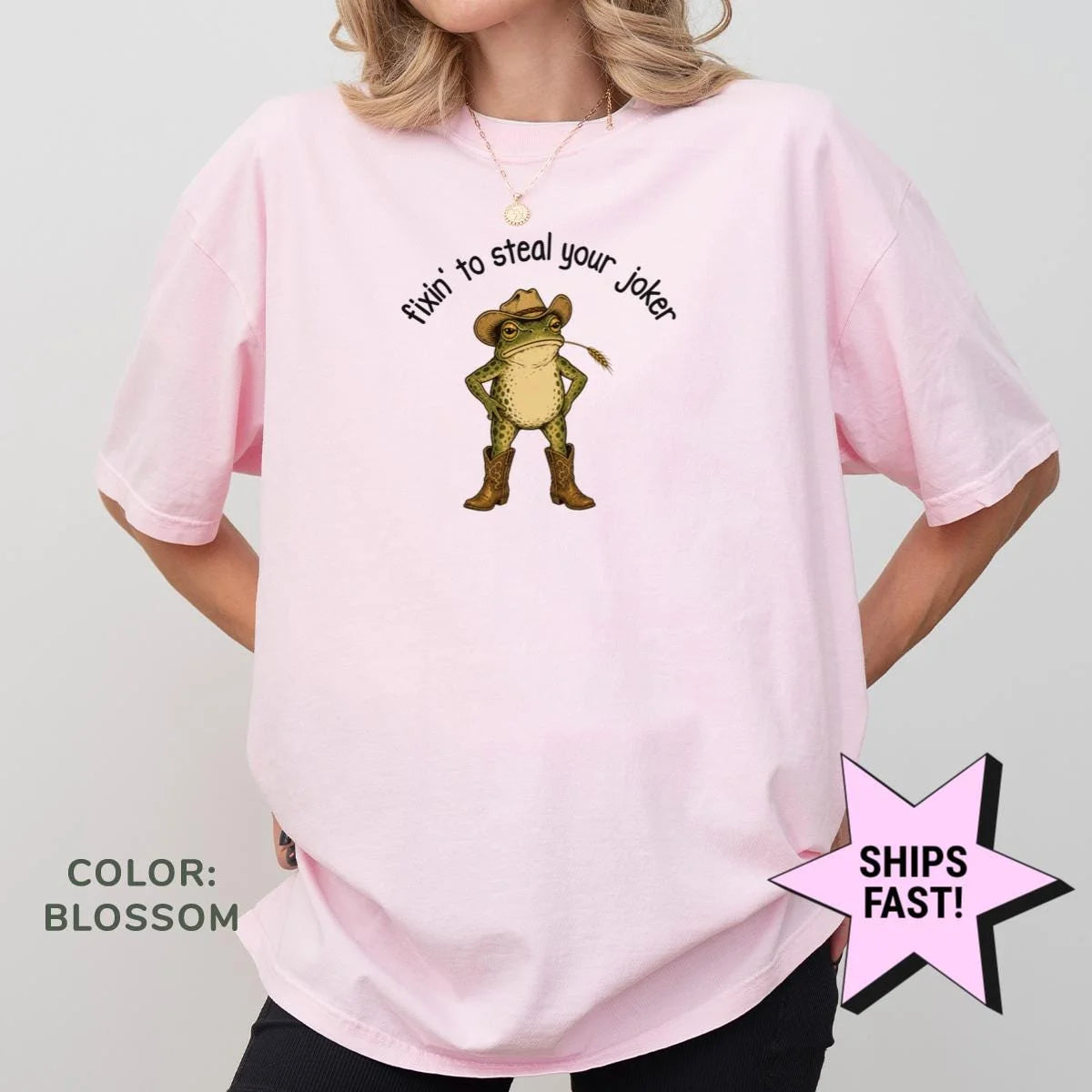 Woman in a Blossom pink Comfort Colors tee with a cowboy frog and arched fixin' to steal your joker text on the chest