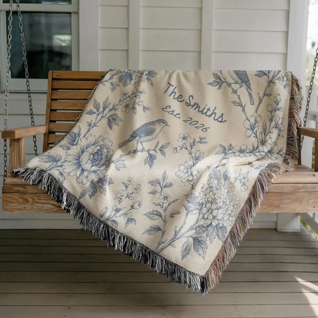 Close-up of the personalized floral bird panel woven blanket with texture and fringe detail