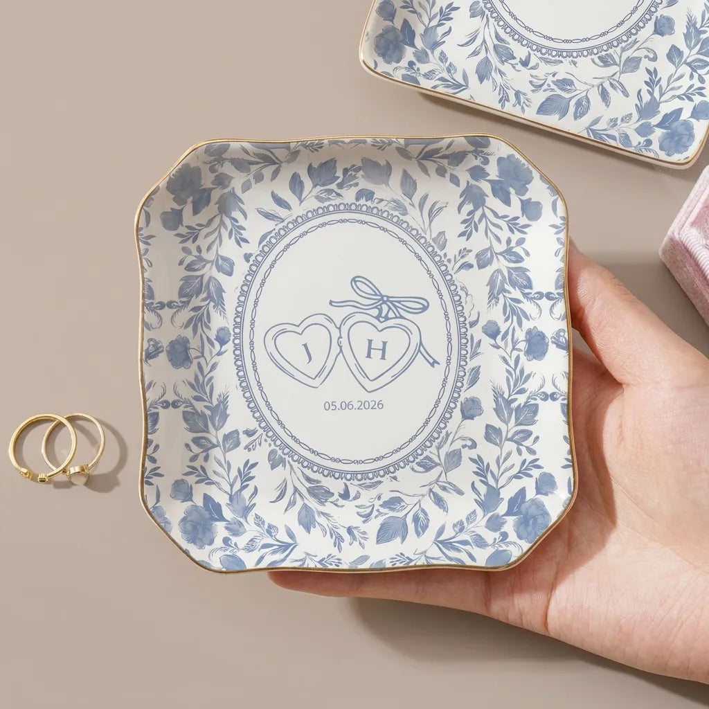 Round personalized watercolor floral toile wedding ring dish with couple initials and date in oval center