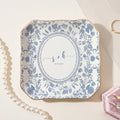 Watercolor floral toile personalized wedding ring dish on beige background with engagement rings
