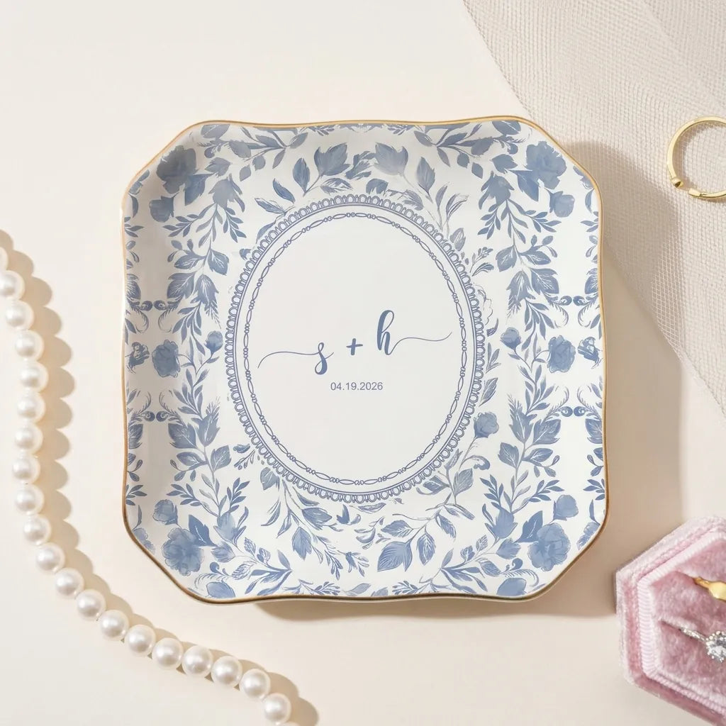 Watercolor floral toile personalized wedding ring dish on beige background with engagement rings