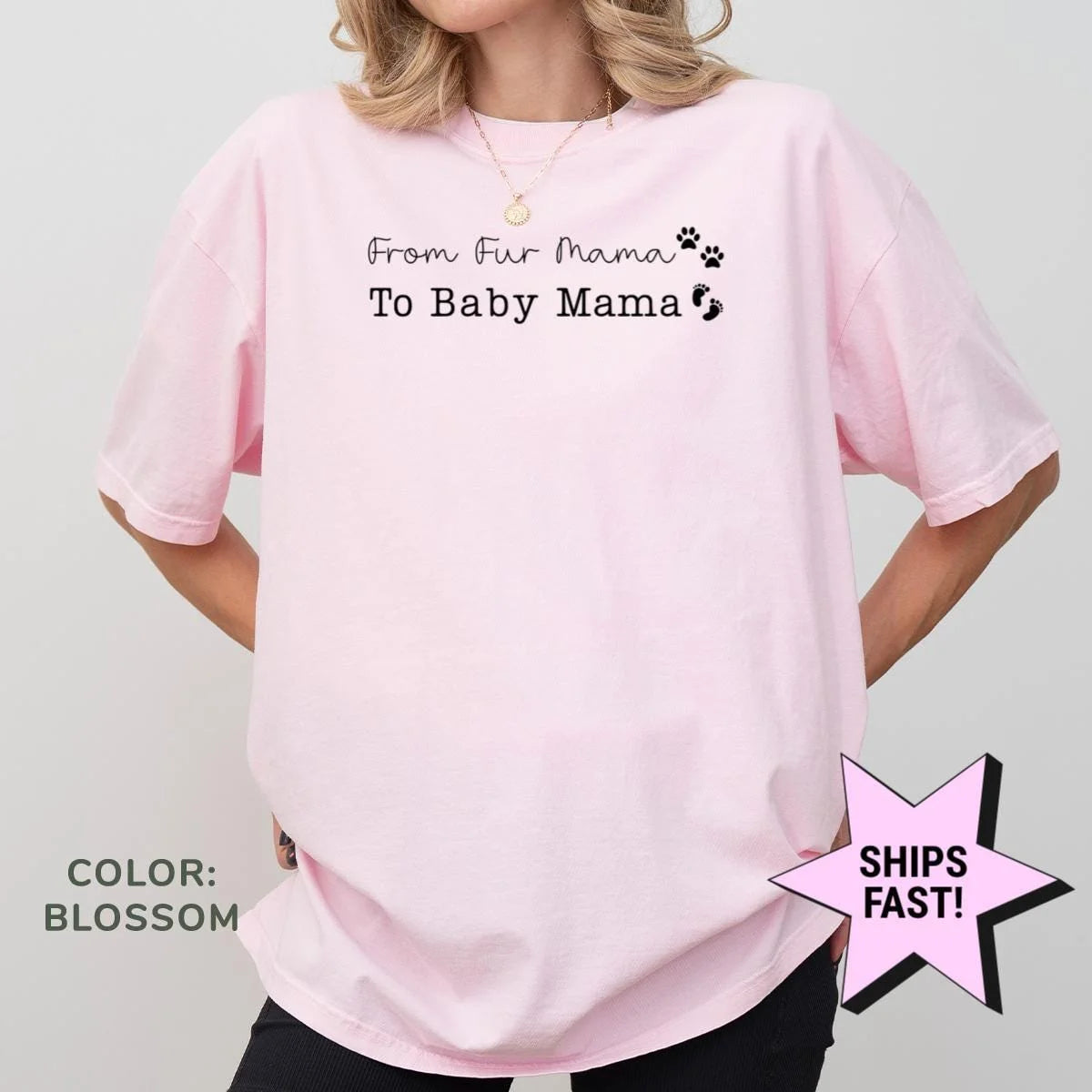 Woman in a Blossom pink Comfort Colors tee, hands on hips, with black from fur mama to baby mama text, paw and baby feet