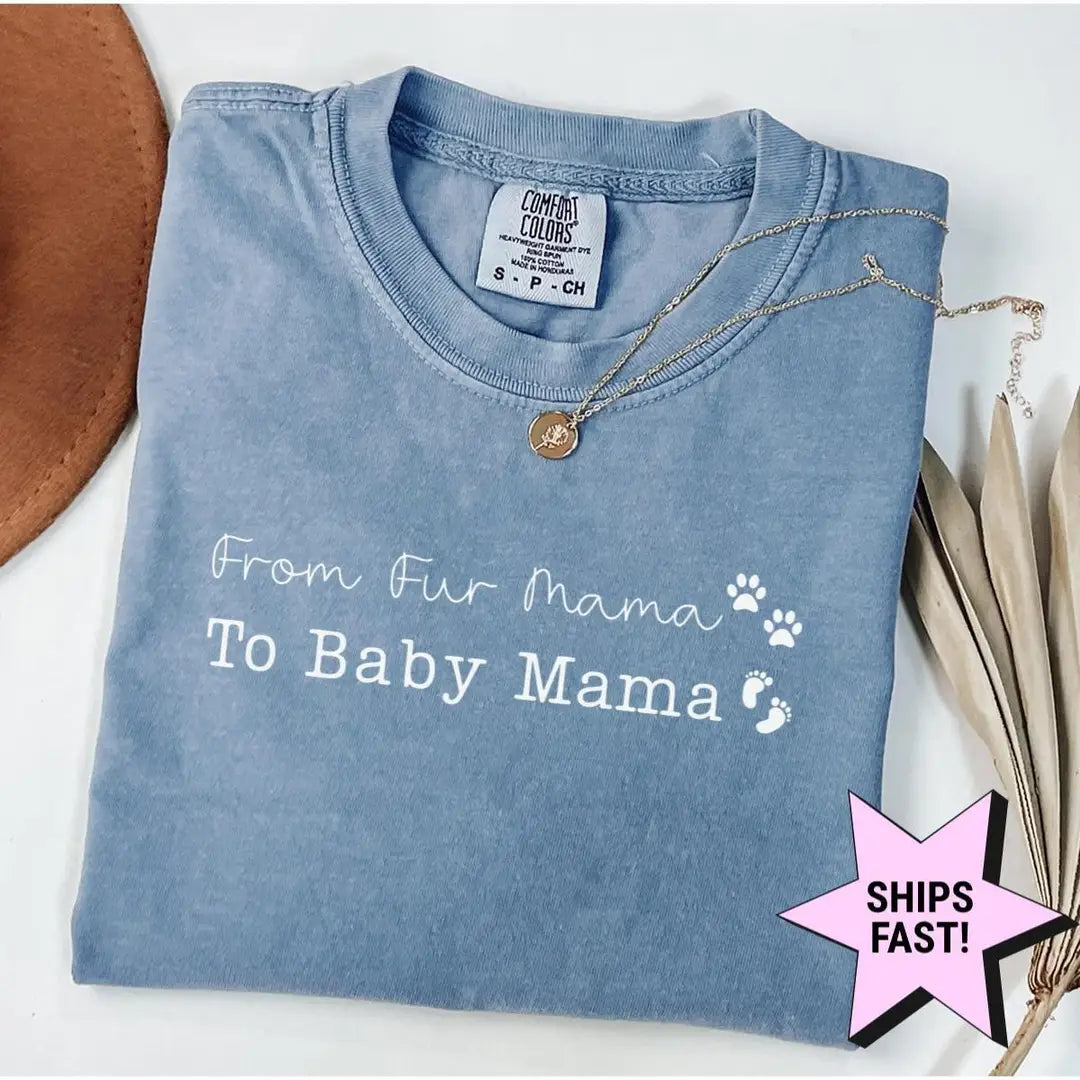 Folded Blue Jean Comfort Colors tee with white from fur mama to baby mama lettering, a paw print and baby footprints
