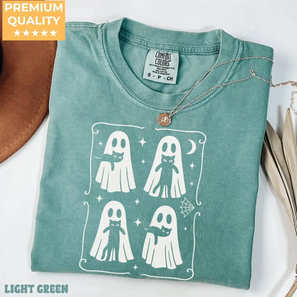 Comfort Colors T-shirt in Pepper color worn by model featuring ghost hugging black cat illustration