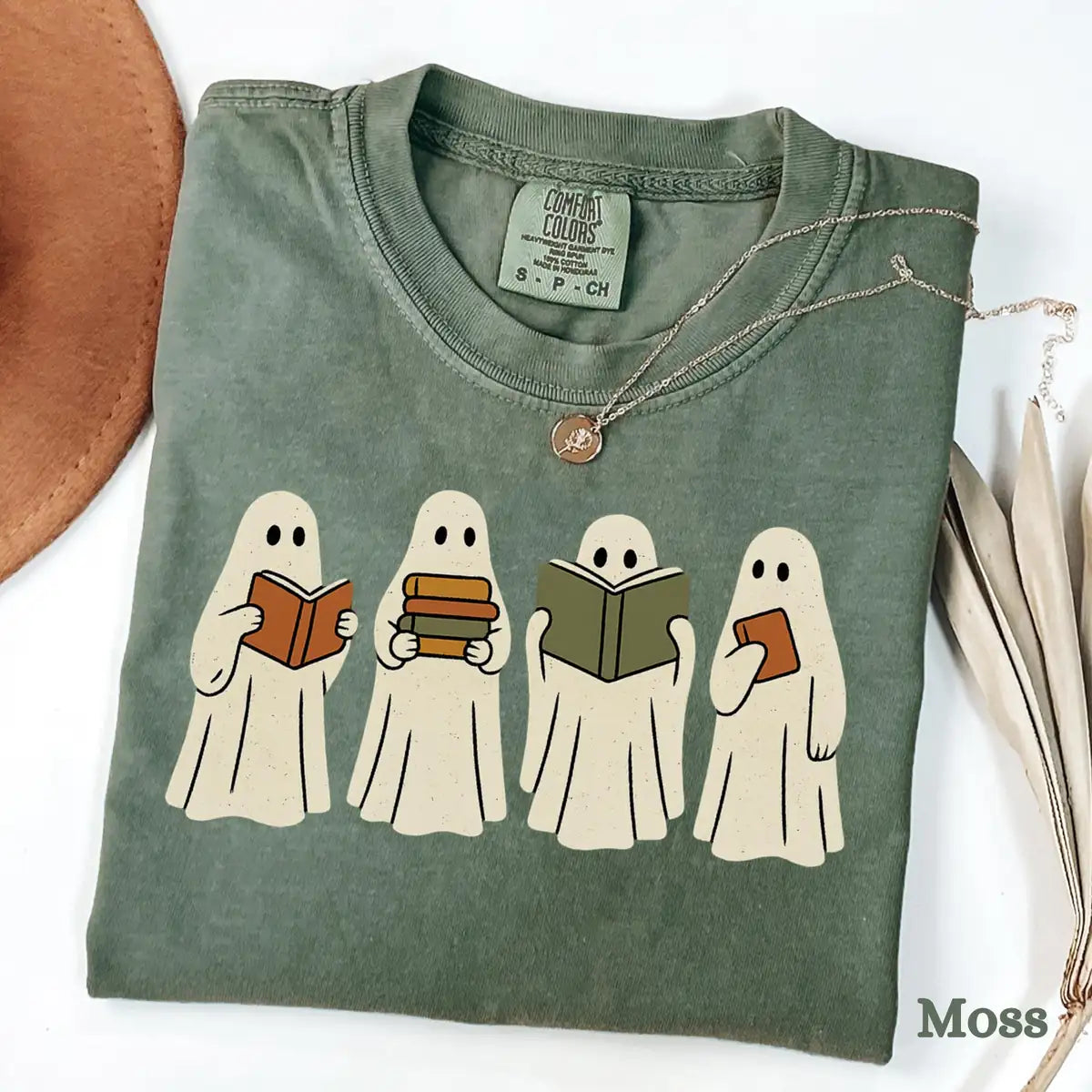 Comfort Colors T-shirt in Moss color featuring ghosts reading books graphic