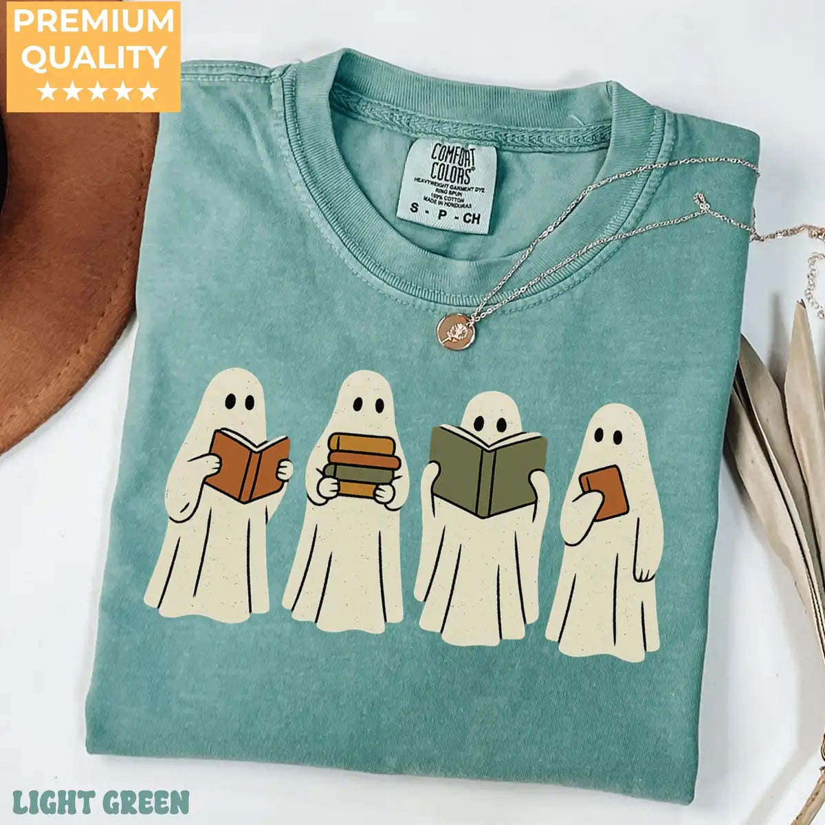 Comfort Colors T-shirt in Yam color featuring ghosts reading books graphic