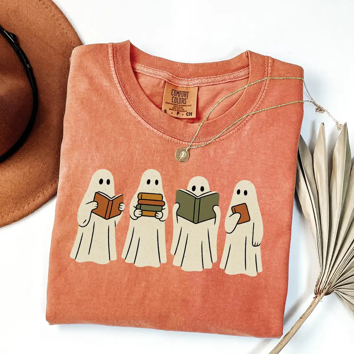 Comfort Colors T-shirt in Crunchberry color featuring ghosts reading books graphic