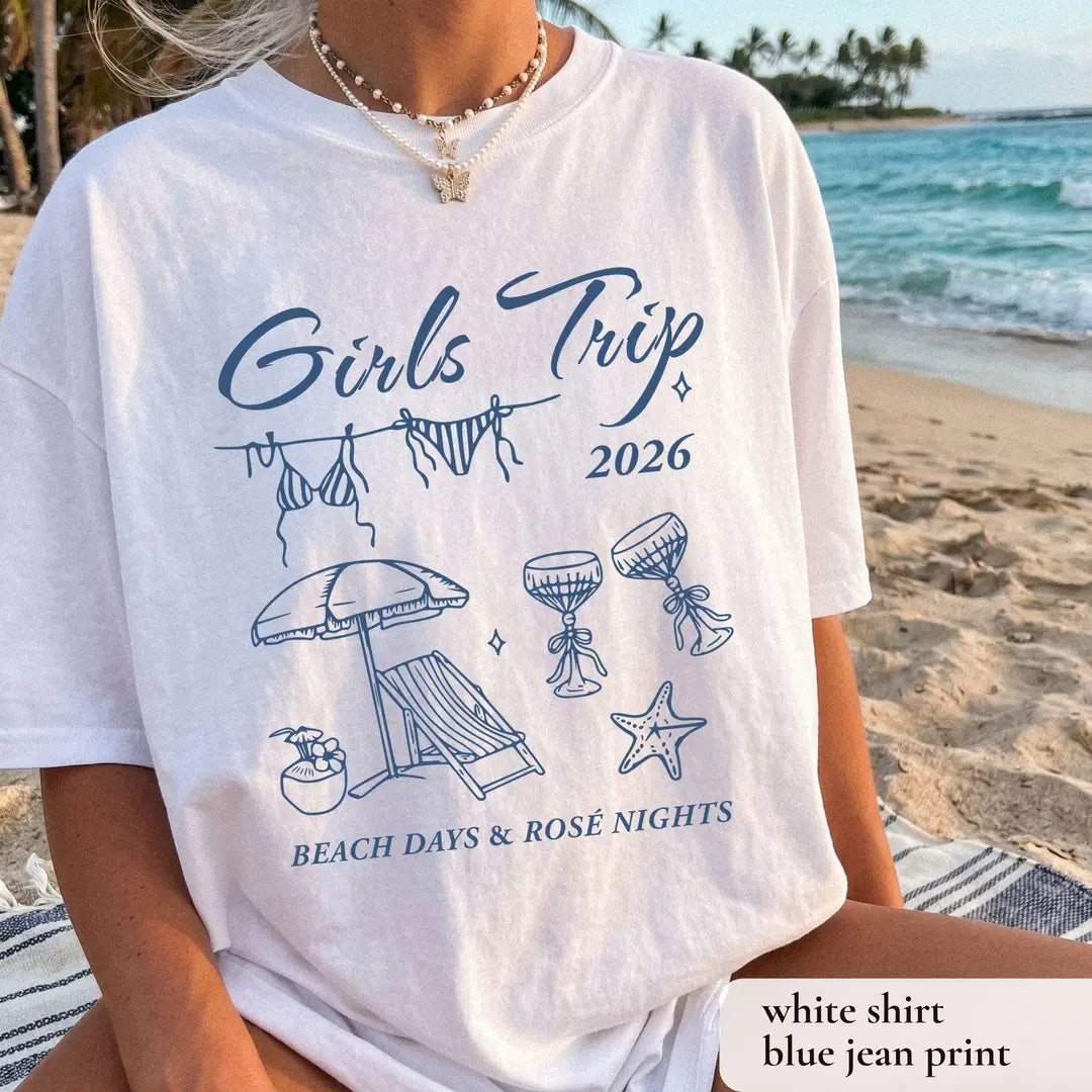 Woman in a White Comfort Colors tee on a beach, blue girls trip 2026 script, bikini line and beach days and rose nights