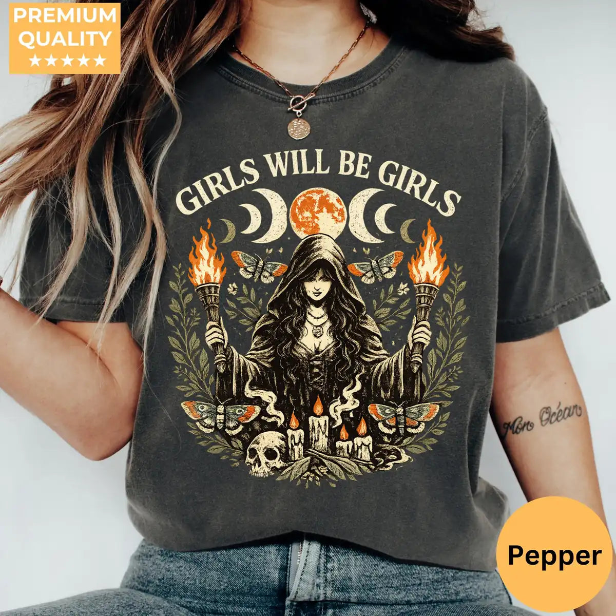 Comfort Colors T-shirt in Pepper color worn by model featuring Girls Will Be Girls witch holding torches graphic