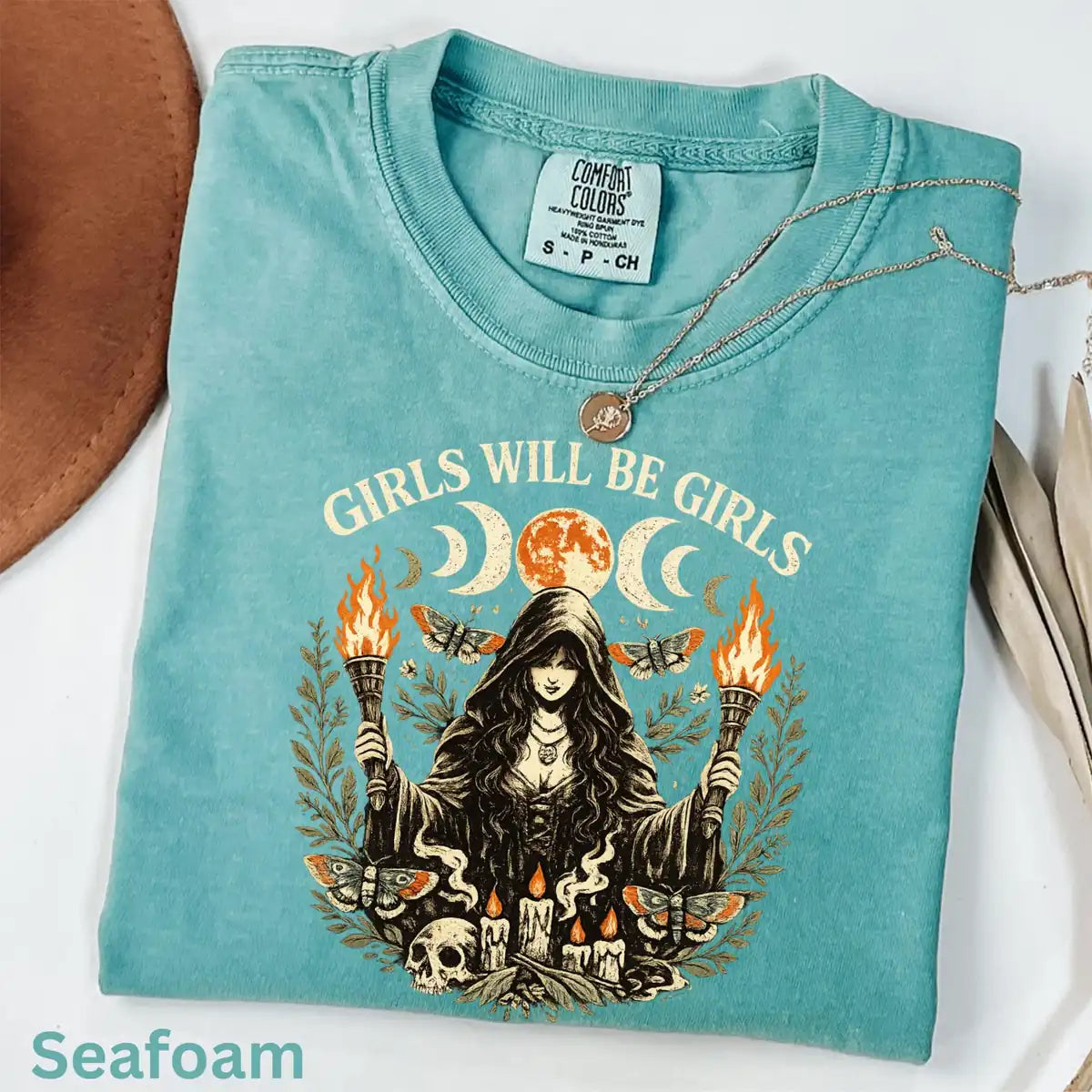Comfort Colors T-shirt in Ivory featuring witch holding torches graphic