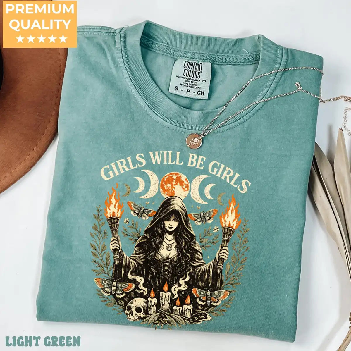 Comfort Colors T-shirt in Terracotta featuring witch holding torches graphic