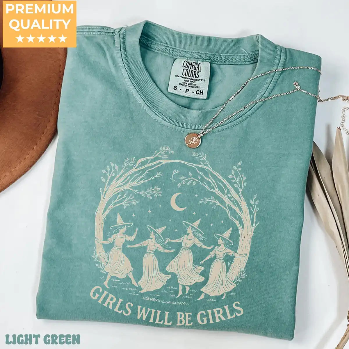 Comfort Colors T-shirt in Moss color featuring Girls Will Be Girls witch moon graphic