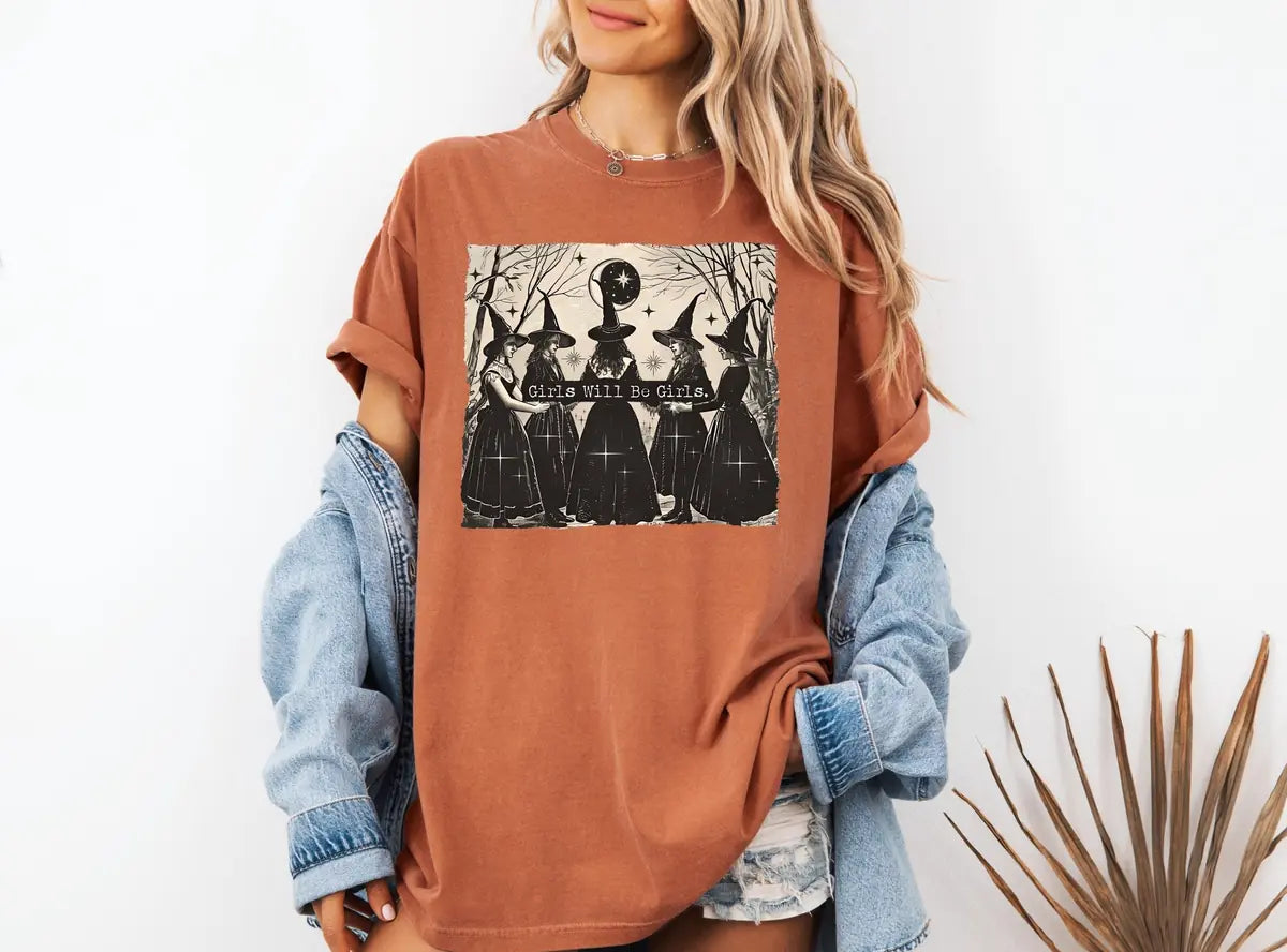 Woman wearing Black Girls Will Be Girls Witches - Vintage Halloween Comfort Colors T-Shirt
