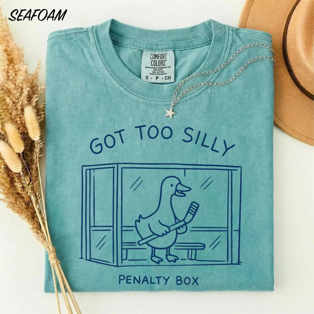 Seafoam Comfort Colors 1717 tee with 'Got too silly – Penalty box' and a cartoon hockey goose.