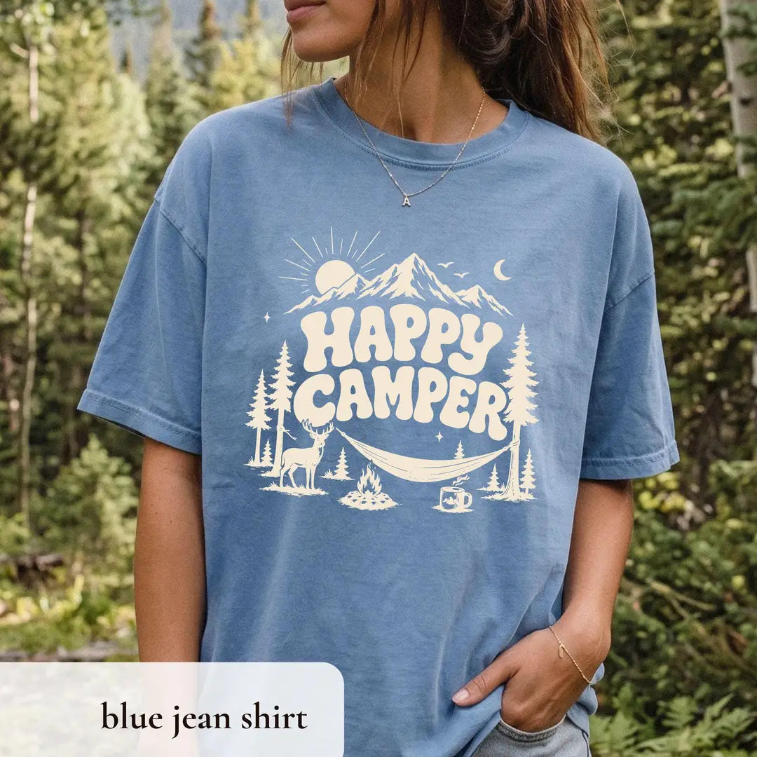 Woman in a Blue Jean Comfort Colors tee in the woods, ivory happy camper, mountain, sun and moon, deer and hammock