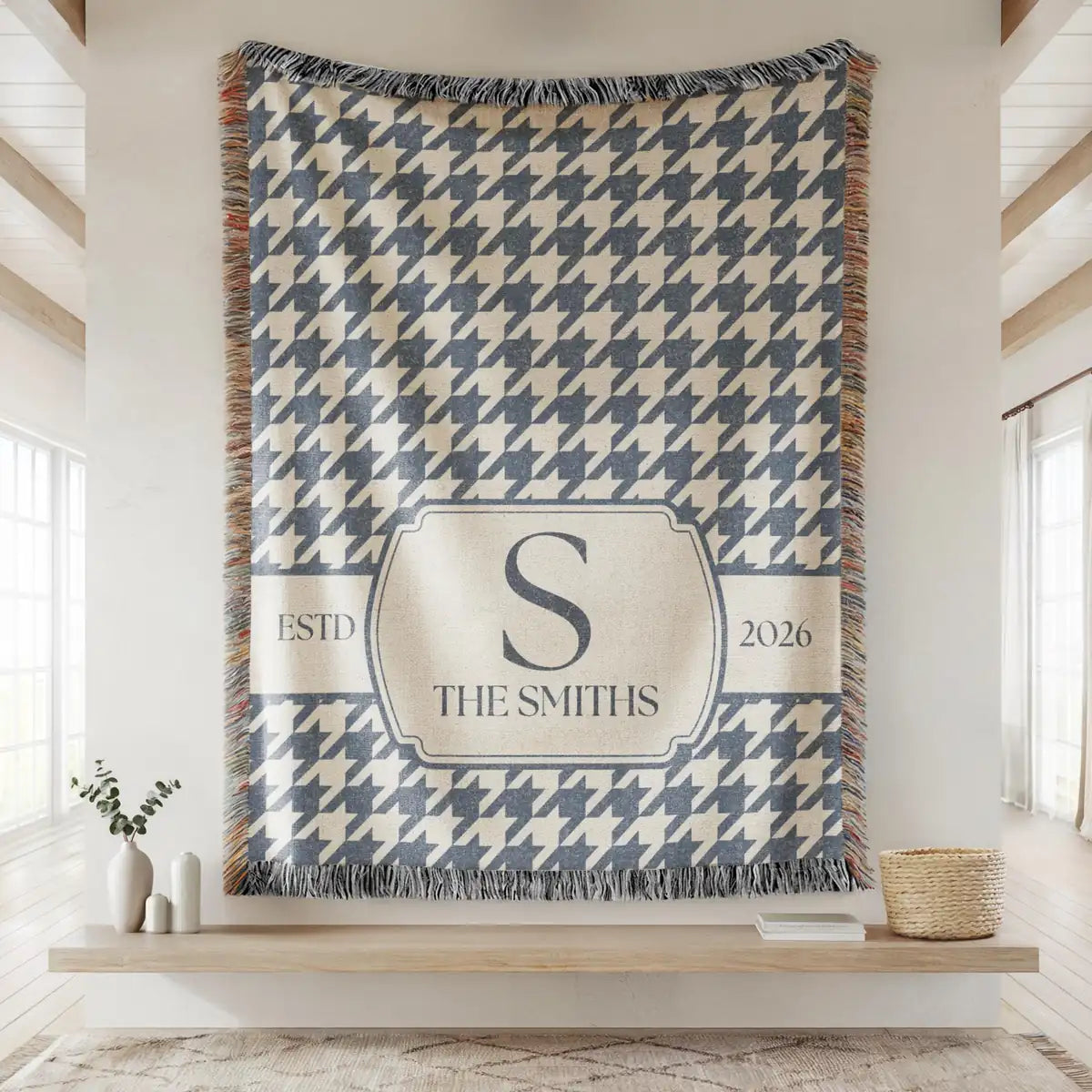 Personalized houndstooth panel woven blanket with monogram shown in a styled room setting