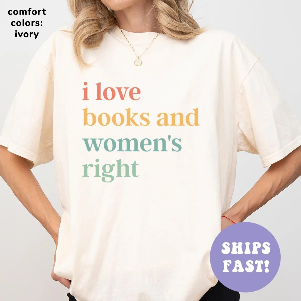 Woman in an Ivory Comfort Colors tee, hands on hips, with four stacked lines in coral, mustard and sage serif letters