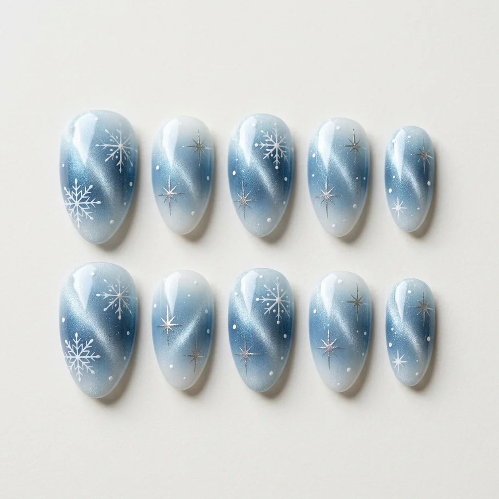 ice blue silver white ombre cat eye almond press on nails winter snowflake glitter flat lay 04