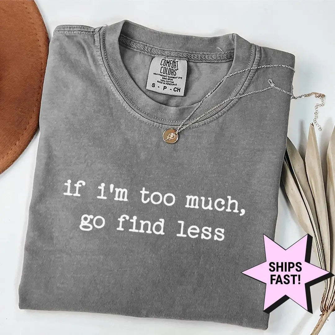 Folded Pepper Comfort Colors tee with if i'm too much, go find less in white typewriter letters, necklace at the collar
