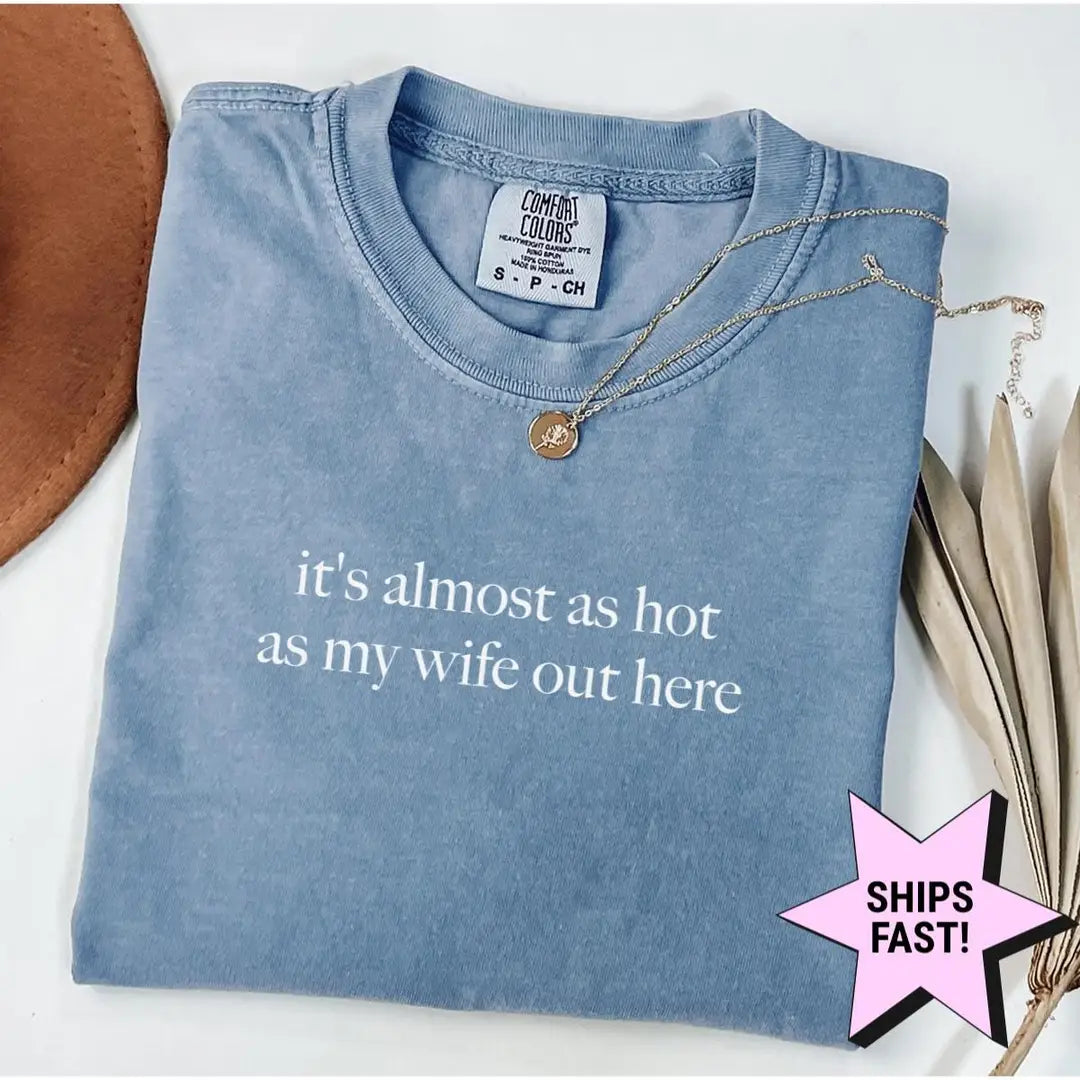 Folded Blue Jean Comfort Colors tee printed it's almost as hot as my wife out here in white, styled with a necklace
