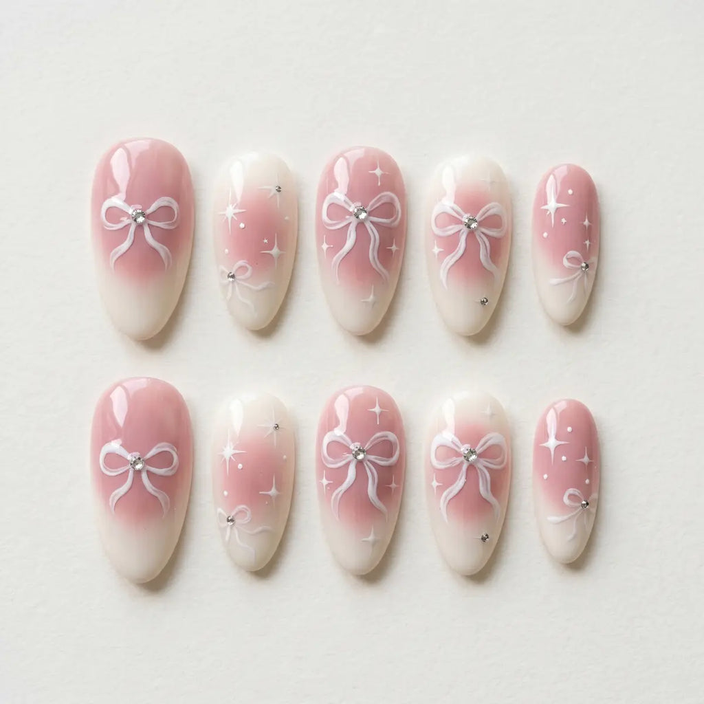 ivory pink hand painted almond long press on nails ribbon bow flat lay 01