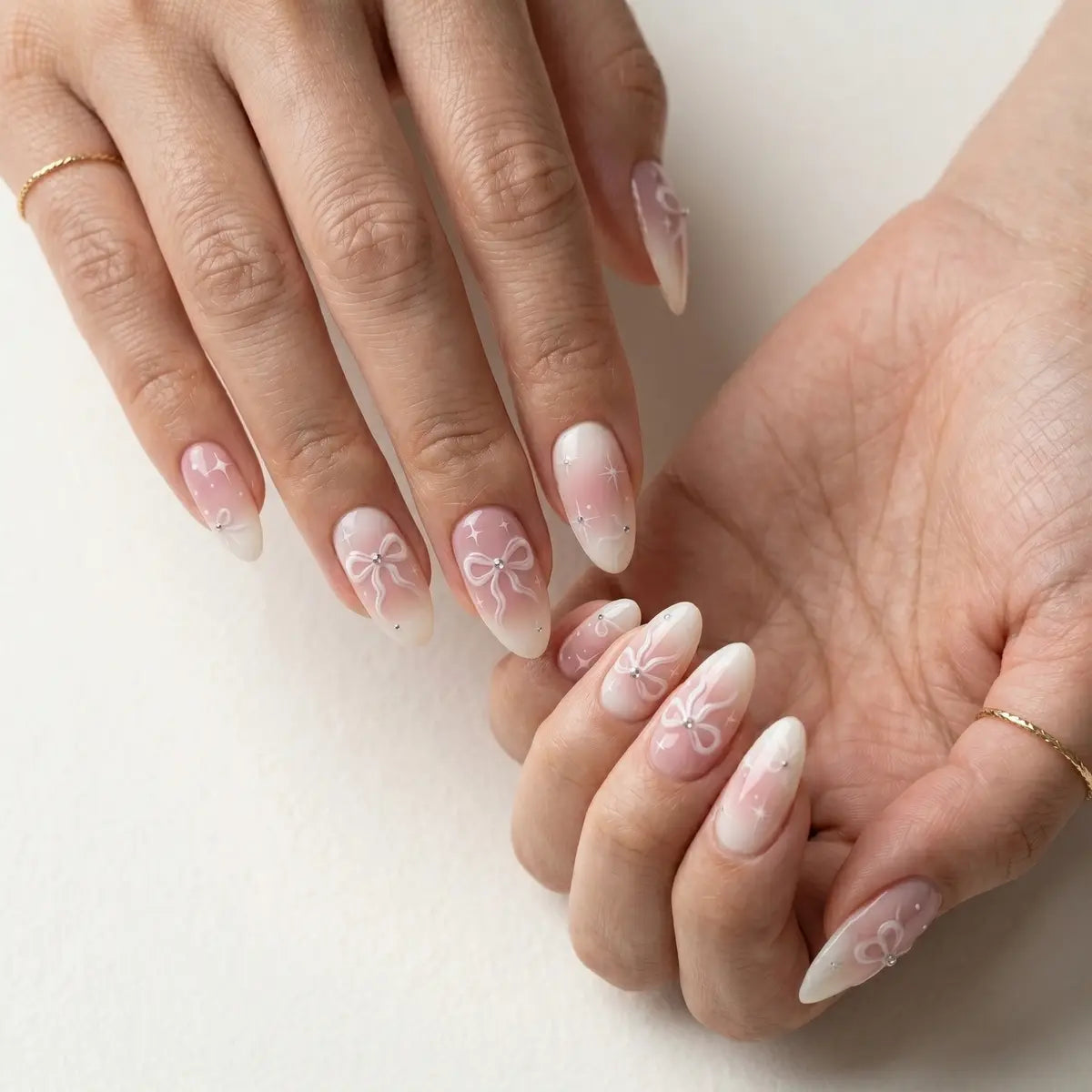 ivory pink hand painted almond long press on nails ribbon bow lifestyle 01