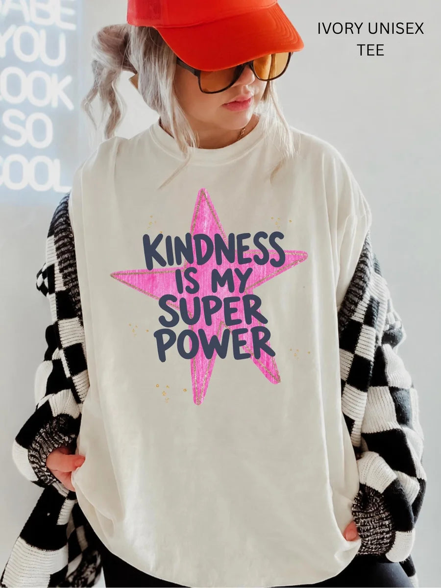 Woman in an Ivory Comfort Colors tee, red cap and checkered cardigan, with navy kindness is my super power on a pink star