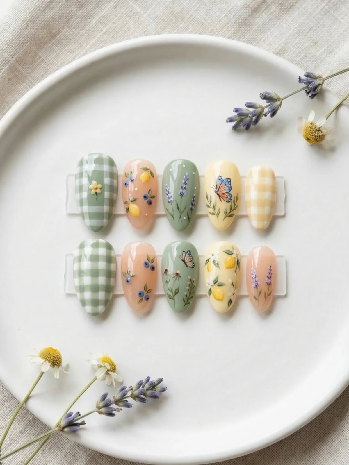 lemon yellow hand painted almond medium press on nails flat lay 01