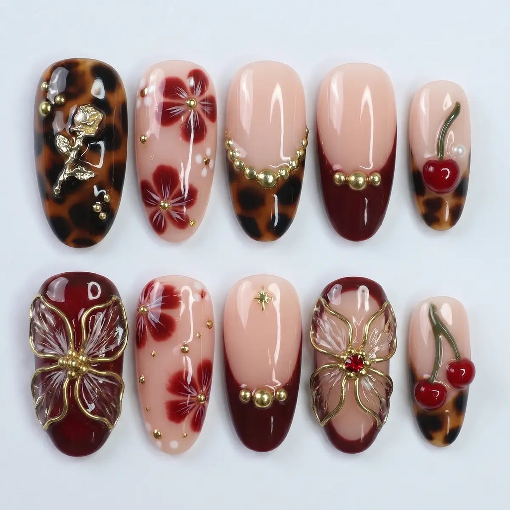 leopard print almond press on nails 3d gold rose cherry butterfly flat lay 01