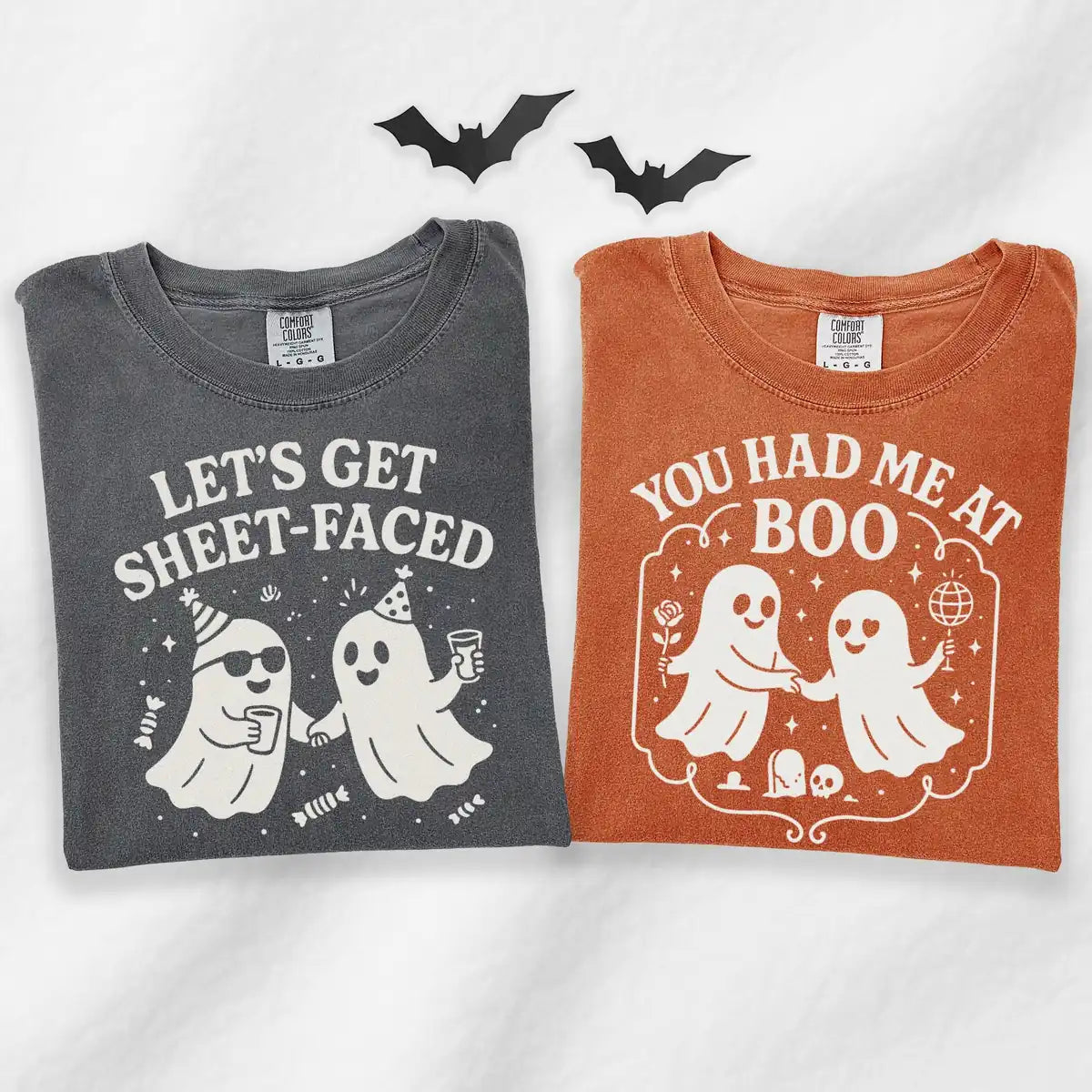 Comfort Colors T-shirt flatlay folded featuring Lets Get Sheet Faced and You Had Me At Boo couple graphic